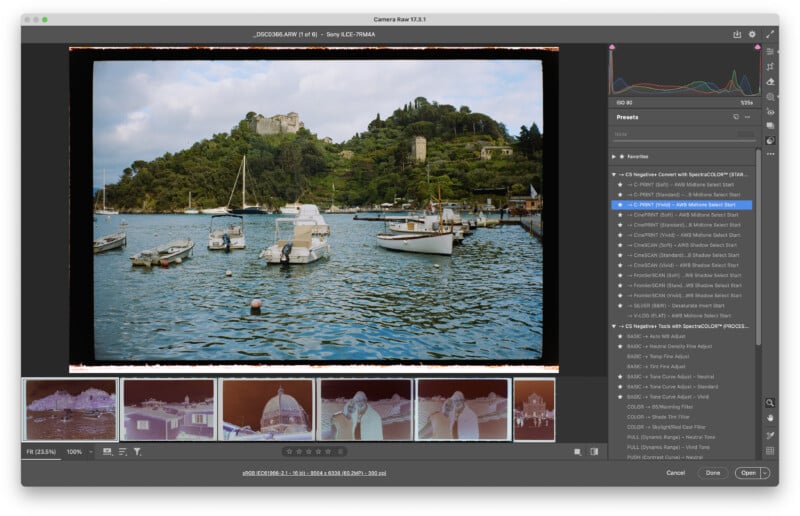 A photo editing software window shows a color film scan of a harbor with boats, calm water, and a green hill with buildings and a castle. Editing tools and filmstrip previews appear along the sides and bottom.